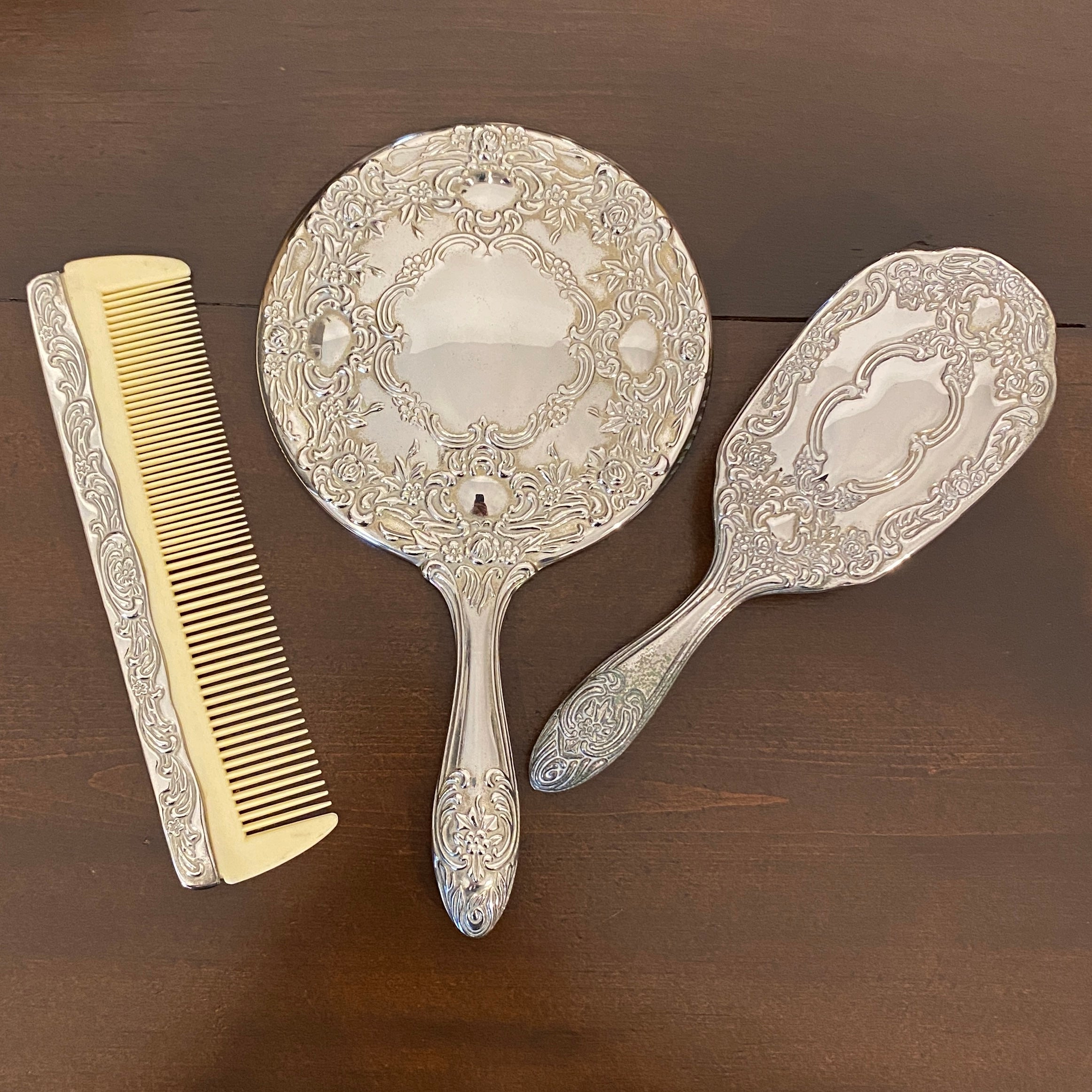 Vintage, three-piece top mirror, brush, and comb vanity set