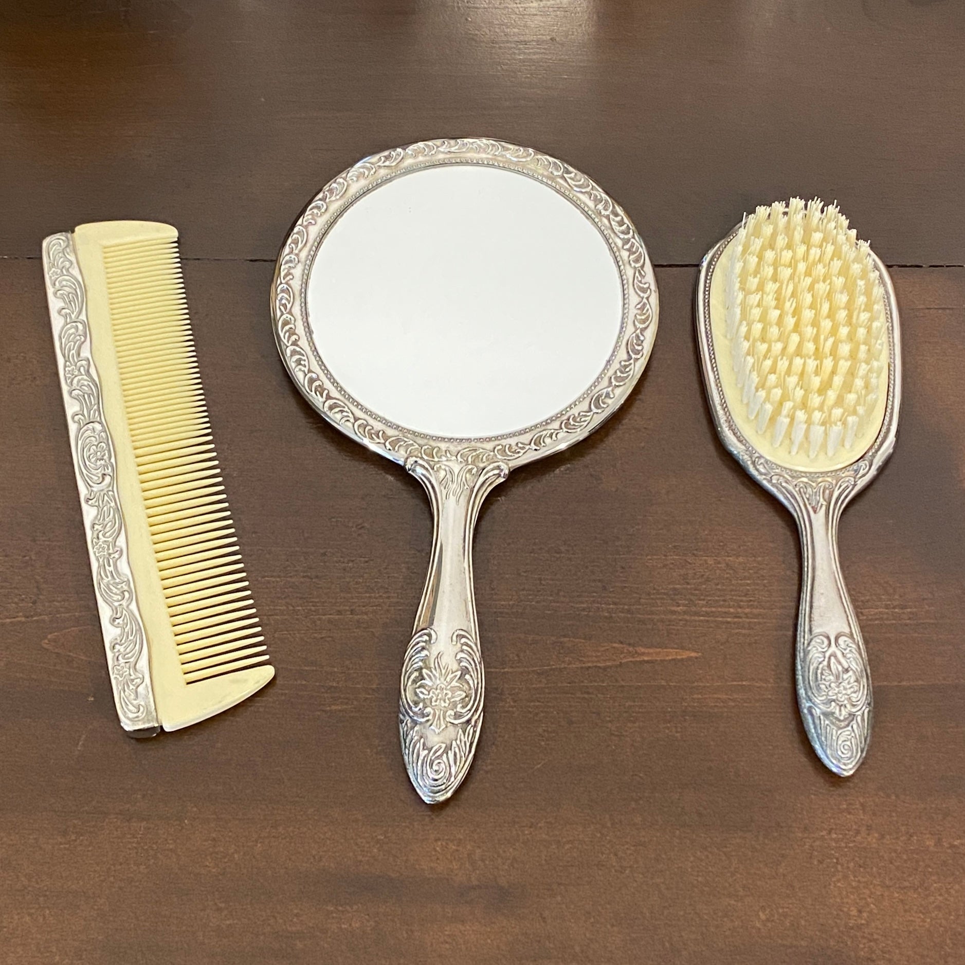 Vintage, three-piece mirror, brush, top and comb vanity set